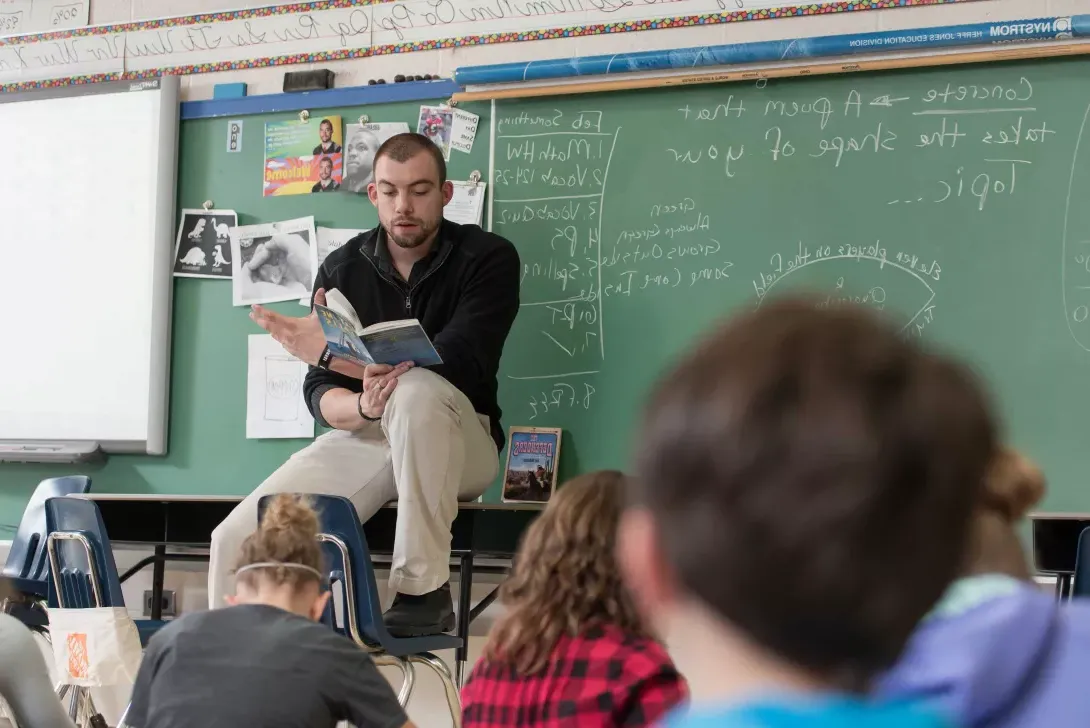 Student teacher reading to class